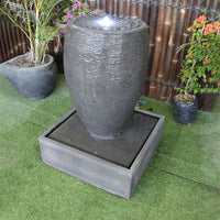 Galleria's Cigar water feature in grey from the right top angle view