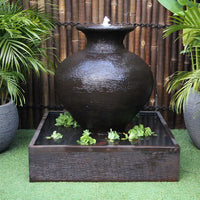 Galleria''s Florentine water fountain in rust among greenery