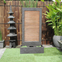 Zig Zag Copper fountain by Galleria Imports in grey in the garden