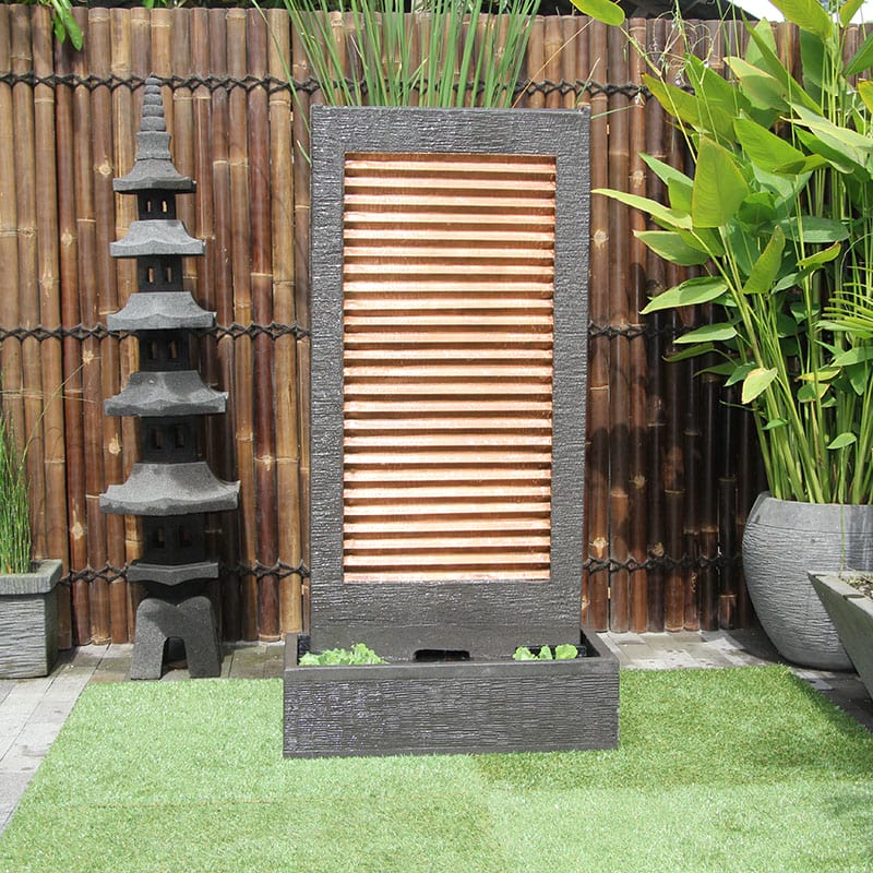 Zig Zag Copper fountain by Galleria Imports in grey in the garden