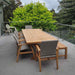 East India Teak Alexander Cross Leg Table with Flinders Wicker chairs on a balcony