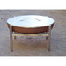 Alfred Riess Fire Pit Cover Medium Stainless on firepit  on concrete floor

