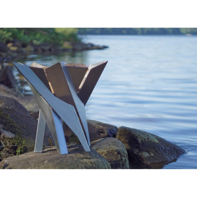 Alfred Riess Lotus Stainless Steel Brazier Large on a rock near water