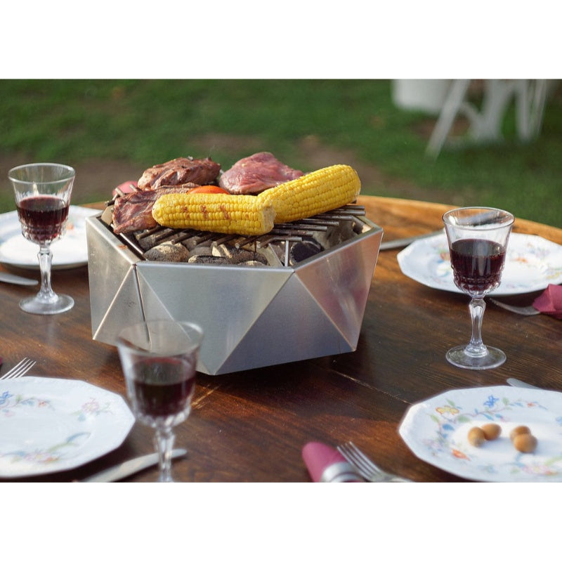 Alfred Riess Stalvirsis Portable Hibachi Grill with food on table
