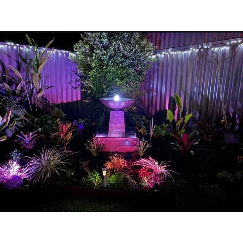 Aquarius Fountain Medium greay featuring LED lights at night