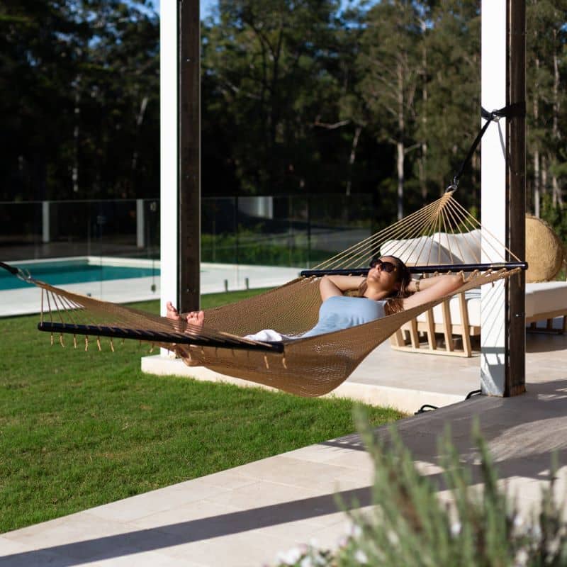 Caribbean Hand Woven Polyester Rope Hammock in Tan lifestyle