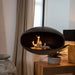 Cocoon Fires Aeris Ethanol Fireplace in Black hanging indoors in front of window