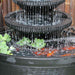 Corner Bowl Fountain Charcoal Close UpCorner bown fountain close up into pond