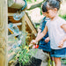 Discovery Woodland Treehouse girl digging