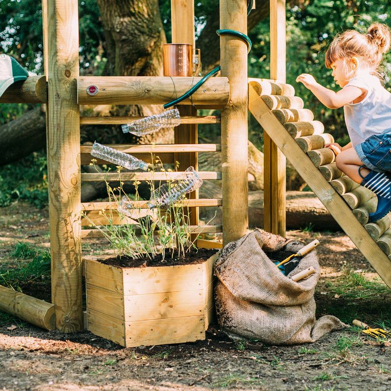 Discovery Woodland Treehouse girl climbing on the treehouse