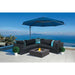 EcoSmart Base 40 Lifestyle ocean view fire pit table under the blue umbrella