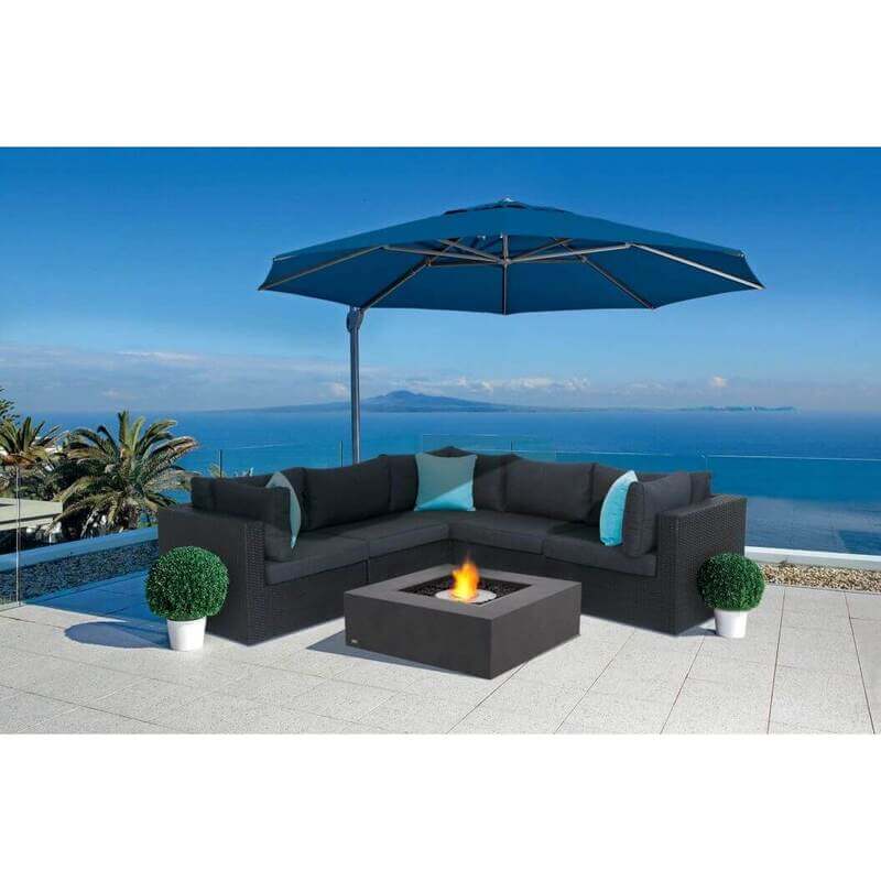 EcoSmart Base 40 Lifestyle ocean view fire pit table under the blue umbrella