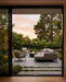 EcoSmart Fire Mimosa 40 Fire Table in a green garden.