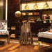 Eosmart Fire stix indoor stainless steel with stainles burner beside a couch
