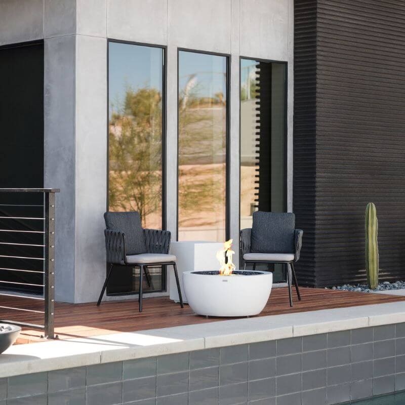 Ecosmart Fire Pod 30 Fire Pit Bowl Bone With Flame with chairs at the deck
