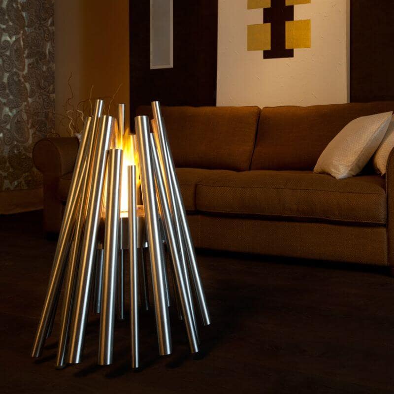 Ecosmart Fire Stix Fire Pit Stainless Steel with Brown sofa behind