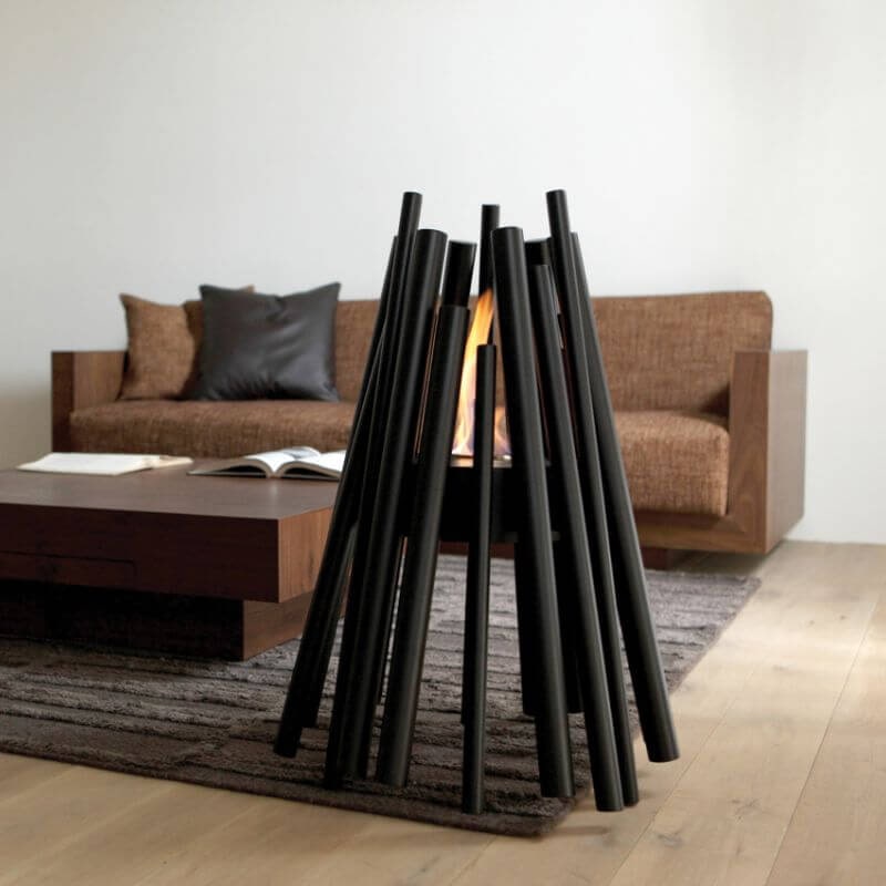 Ecosmart Fire Stix fire pit in Balck indoor beside brown sofa