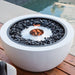 Ecosmart pod 30 fire pit table beside the pool