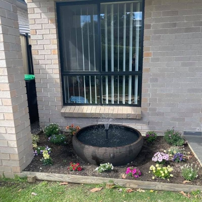 Fish Pond Fountain grey with flowers