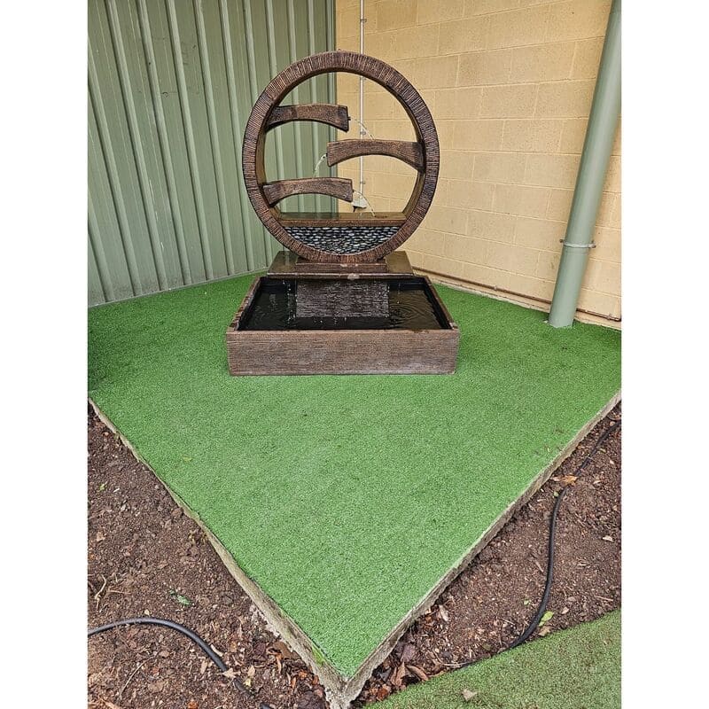 Galleria Imports Wagon Wheel Fountain Large Rust with artificial greenery