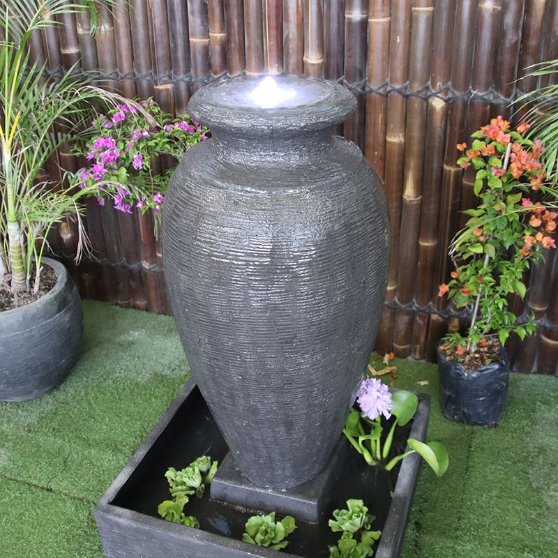 Amphora by Galleria top angle view of grey water feature looking at LED light and water