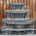 Grey corner bowl fountain by Galleria Imports close up of streaming water