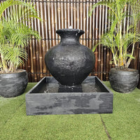 Galleria's Florentine Fountain in charcoal with greenery