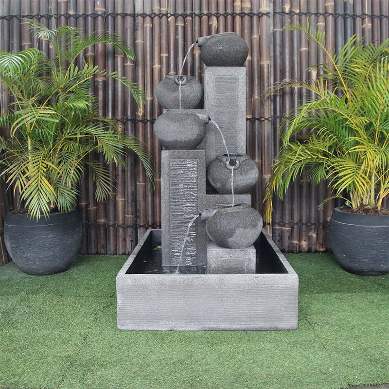 Streaming Pots Fountain by Galleria Imports in large grey front view in the garden