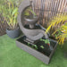 Verona Fountain by Galleria top view in rust with fish in the pond