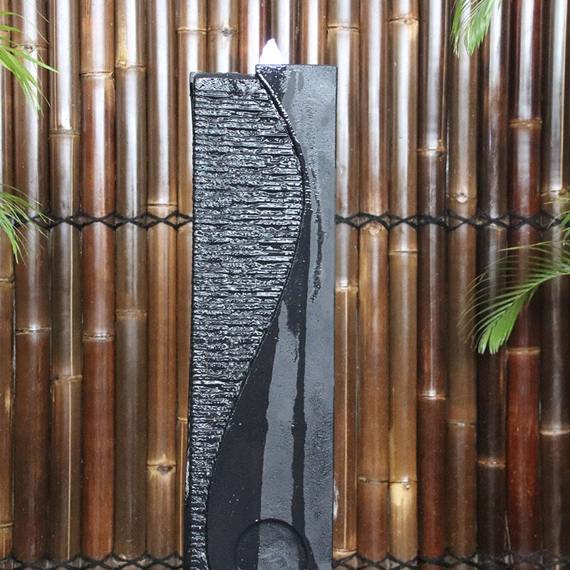 Galleria Imports Ying Yang Fountain in charcoal top close up with water flowing