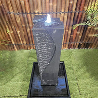 Galleria Imports Ying Yang Fountain in charcoal top view with LED light on
