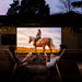 XGIMI Halo+ Portable Projector couple watching outdoor