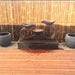 Infinity Fountain in Rust with bamboo background and deck