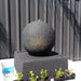 Small Luna Ball Fountain in Grey  with grey wall fence