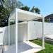 Luxi Living Baltic Manual Freestanding Louvre Roof Aluminium Pergola - white pergola beside a white fence