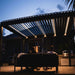 Luxi Living Baltic Motorised Freestanding Louvre Roof Aluminium Pergola - people underneath pergola evening.