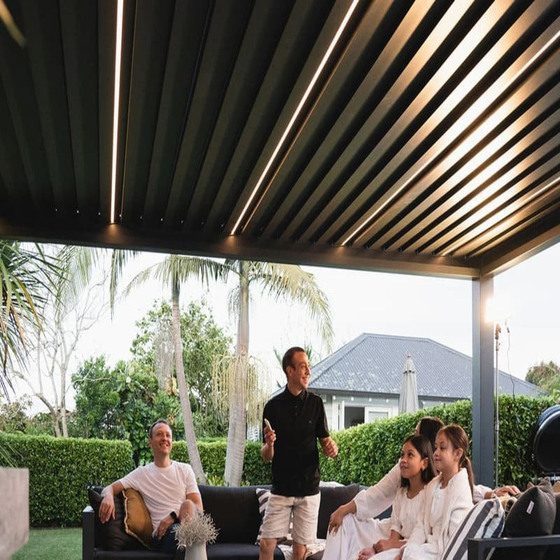 Luxi Living Baltic Motorised Freestanding Louvre Roof Aluminium Pergola - people under the pergola