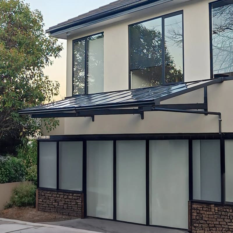 Luxi Living City Window / Door Awning Canopy setup on a cream coloured house.