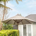 Luxi Living Nile 2.7m Round Market Umbrella - umbrella beside a house