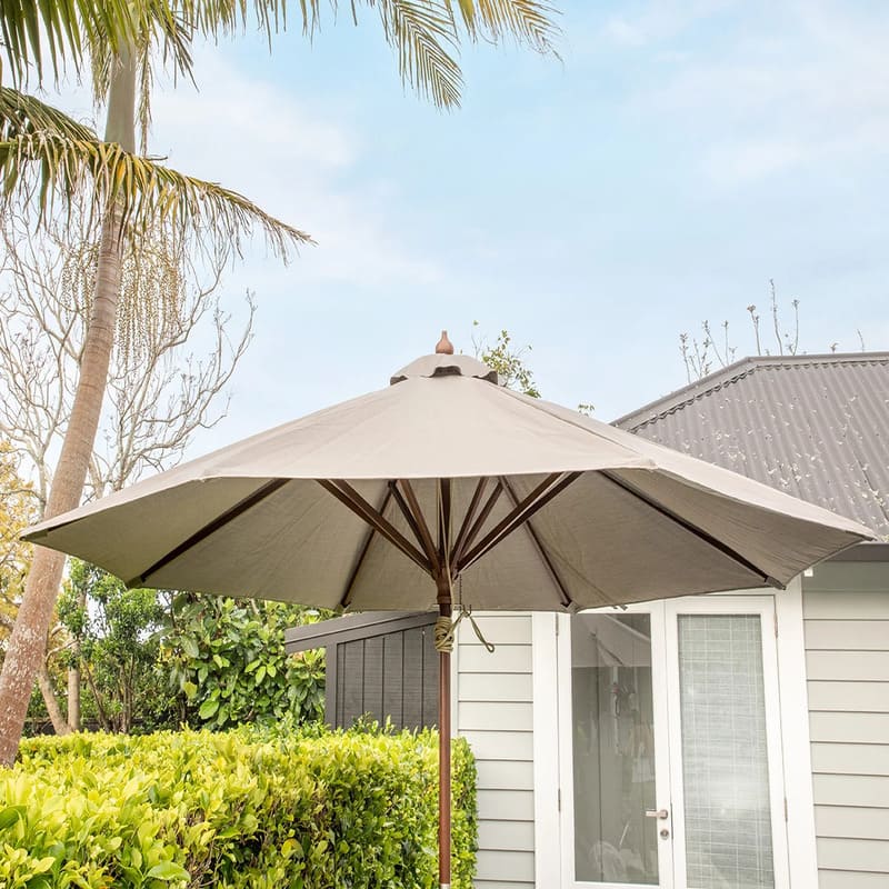 Luxi Living Nile 2.7m Round Market Umbrella - umbrella beside a house