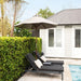Luxi Living Nile 2.7m Round Market Umbrella - 2 chairs under the taupe umbrella by the pool