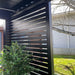 Luxi Living Slatted Privacy Wall for Baltic Wall Mounted Pergola setup beside lawn
