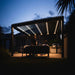 Luxi Living Tasman Motorised Freestanding Louvre Roof Aluminium Pergola- pergola at Night time