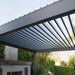 Luxi Living Tasman Motorised Freestanding Louvre Roof Aluminium Pergola - charcoal pergola opened