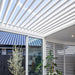 Luxi Living Tasman Motorised Freestanding Louvre Roof Aluminium Pergola - white pergola opened with plants underneath