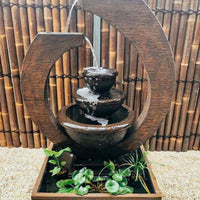Original Eclipse Fountain Large Rust Lifestyle with floating plants