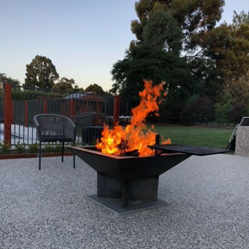 Pinnacle BBQ Firepit full flame on concrete setup