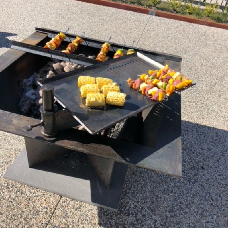 Pinnacle BBQ Firepit cooking corn and shishkebabs