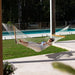 Resort King Polyester Rope Hammock Cream with person beside the Pool