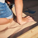 Siamang Wooden Playcentre kid's hand on sand